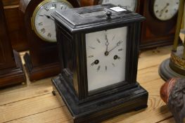An ebonised cased small mantel clock.