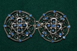 A decorative belt buckle.