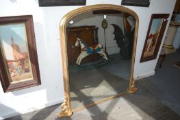 A Victorian gilt framed over-mantel mirror.