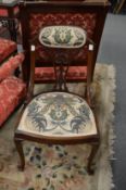 A pair of mahogany occasional chairs.