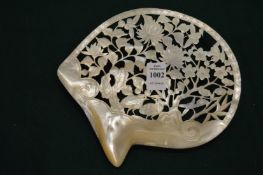A Chinese carved and engraved mother of pearl shell dish (cracked).