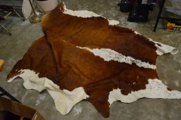 A cow hide rug.