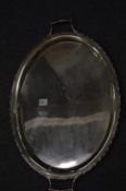 A silver oval twin handled tray.