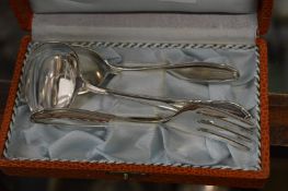 A Continental cased silver spoon and fork Christening set together with similar spoon.