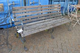 A good large wrought iron and wooden slatted garden bench.