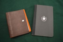 Two notebooks.