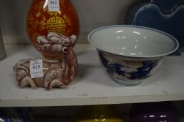 A Kylin brush rest and a Chinese porcelain bowl.