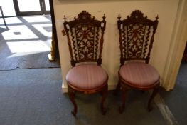 A pair of Victorian carved walnut occasional chairs.