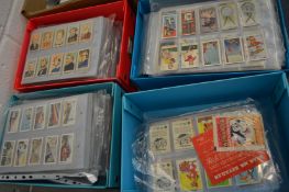 A large collection of cigarette cards in sleeves.