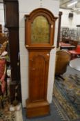 A 19th century oak longcase clock with eight day movement, the arched brass dial signed Robert