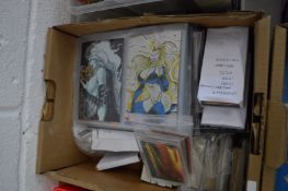A box of comic related collectors cards.