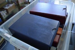 A box of eight cigarette card albums.