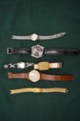 A small group of wristwatches.