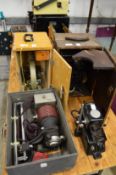 A microscope, projector and other items.
