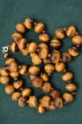 A tigers eye bead necklace.