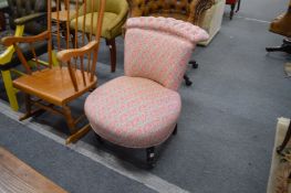 A Victorian upholstered bedroom chair.