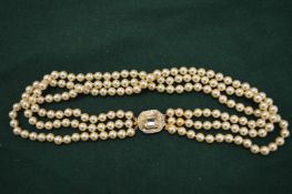 A good pearl necklace with decorative clasp.