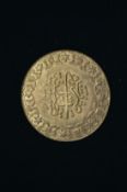 A Turkish Ottoman Kurush yellow metal coin or medallion.
