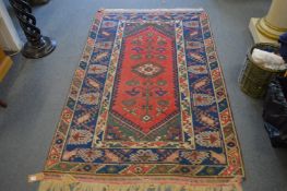 Persian style rug with geometric decoration, 195cm x 123cm.