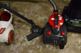 A Status compact vacuum cleaner.