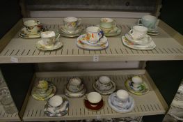 A collection of porcelain trios.