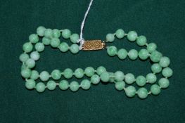 A jade bead necklace.