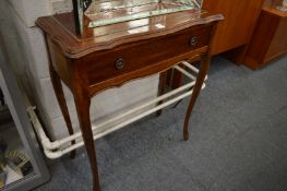A mahogany side table.