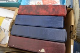 Four albums of cigarette cards.