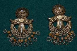 A pair of signed earrings.