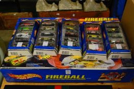 A Hot Wheels Fireball set and five packs of Hot Wheels cars.