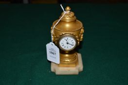 A good ormolu desk clock of classical urn shaped form.