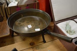 An early bronze three footed skillet.