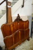 A French walnut double bed frame with base.