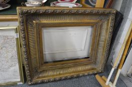 A gilt picture frame.