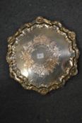 A good silver plated salver with shell decorated border.
