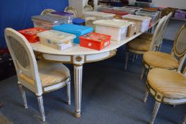 A large painted extending dining table.