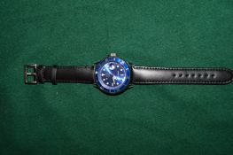 A gentlemans Light Time wristwatch with leather strap.