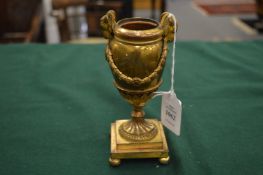 A small ormolu bronze urn with classical mounts.