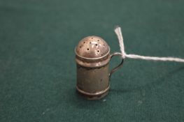 A small silver pepperette or pounce pot.