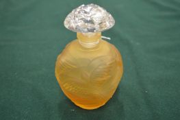 A small amber colour frosted glass scent bottle with clear cut glass stopper.
