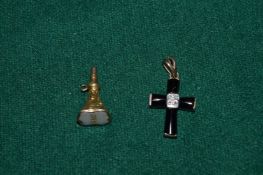 A small seal and a crucifix.