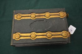 A good Victorian brass mounted leather photograph album and contents.