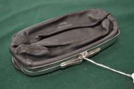 An unusual Continental silver mounted leather pouch, possibly for tobacco.