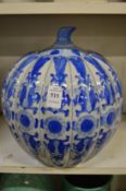 A Chinese melon shaped blue and white decorated jar and cover.