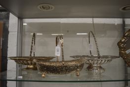 Three silver plated swing handled baskets.