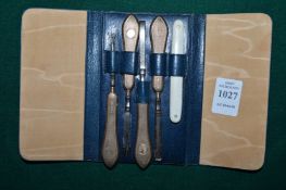 A cased set of 9ct gold handled manicure items.