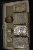 A collection of four silver card cases with engraved decoration, two engraved silver vesta's and a