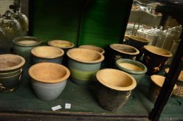 A collection of small pottery planters.