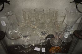 Cut glass and moulded glass rummers, a decanter and a trumpet shaped vase.