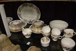 A quantity of Wedgwood Hathaway Rose and Royal Worcester June Garland dinnerware.